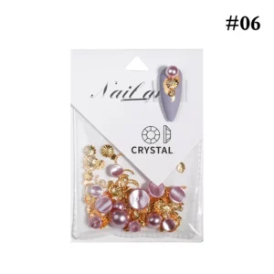 Rose pink pearls with golden floral nail art elements