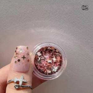 Rose-toned nail glitter flakes with star shapes and metallic accents