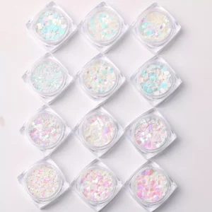 Top view of 12 jars of round aurora nail sequins