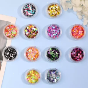 Round glitter nail decorations in assorted holographic and neon tones