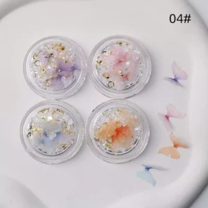 Sheer butterfly nail charms with iridescent pearls and glitter