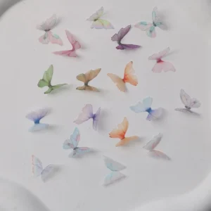 Assorted sheer butterfly nail charms in multicolor pastel shades