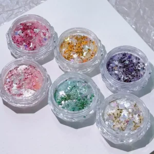 Shell Glitter Nail Charms set featuring dried flowers and iridescent flakes in clear pots
