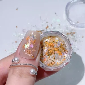 Yellow dried flowers and shell glitter for nail art on thumbnail