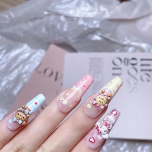 Side view of pastel long nails decorated with 3D Mikko bunny and bear charms