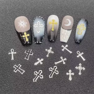 Silver cross nail charms styled on monochrome Gothic nails