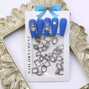 Packaged silver alloy frame nail charms with bold blue nail art