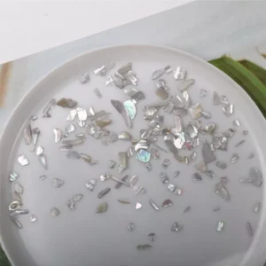 Gray-silver natural shell flakes with subtle holographic reflections