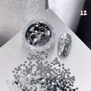Silver hexagon glitter for nail art with mirrored metallic finish on nail tip
