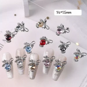 Floating silver bow nail charms with various crystal colors on styled nails