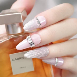 Minimalist silver square nail studs used on pink almond nails