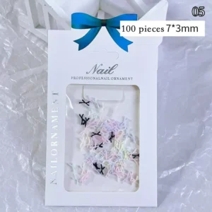 Slender pastel and black bow nail charms in resin – 100pcs, 7×3mm