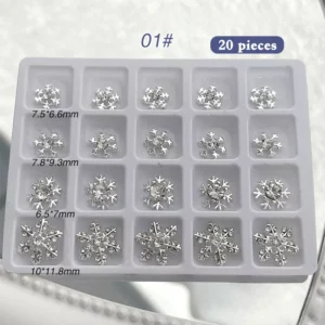 20 pieces of silver rhinestone snowflake nail charms in mixed sizes and styles in tray 01