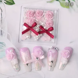 Peach-pink floral nail kit with ivory roses and textured bows