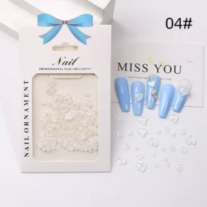 White heart-shaped nail accents in organized packaging