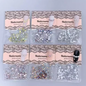 Flatback nail crystals in assorted sparkling colors and sizes displayed in professional packaging