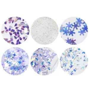 Blue and iridescent nail glitter flakes including moons, snowflakes, and fine dust