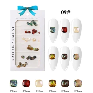 Square-cut resin nail art gems in earthy multicolor finishes, including red, green, pearl, and amber