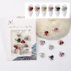 Stacked Heart Nail Charms - Sparkling K9 Zircon Crystals 5 Mixed color stacked heart nail charms with K9 zircon and pearls in retail packaging