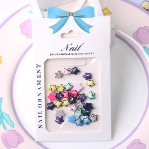 Packaged 3D star Y2K nail charms in pastel and bold tones