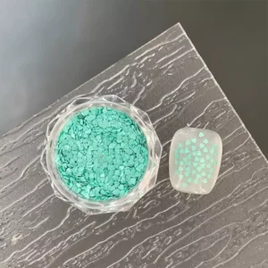 Turquoise heart-shaped glitter for refreshing nail art.