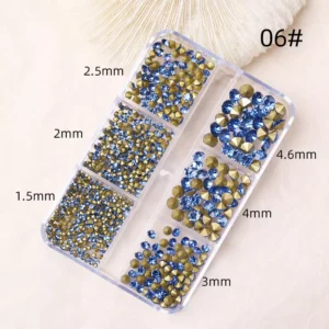 Colorful rhinestone nail art gems in various sizes for nail decoration