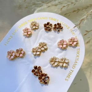 Pink and brown vintage metal flower charms on round backing card