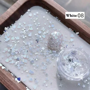 White holographic nail glitter spilled on tray with snowflake effect