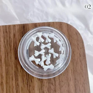White matte resin bow nail charms with soft finish, no pearls