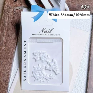 White bow tie nail charms packaging in two sizes