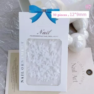 Pure white resin 3D bow charms in minimalist packaging
