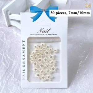 White 3D starfruit nail embellishments in delicate pastel tone