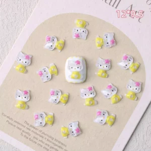 Yellow-dressed cat resin nail charms with pink bows
