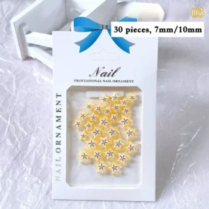Yellow tropical nail charms shaped like starfruit, glossy resin finish