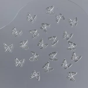 Assorted silver butterfly nail charms with zircon detail