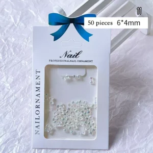 Holographic mini bow nail charms in transparent AB finish