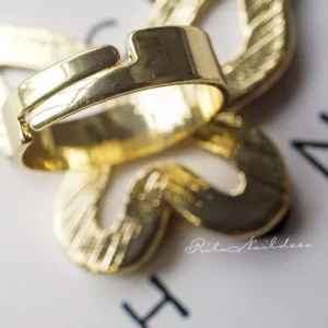 Close-up of adjustable gold alloy ring band on nail art palette ring
