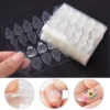 Clear Jelly Nail Glue Tabs - No Mess, Just Press 21 Clear jelly nail glue tabs for press-on nails shown on fingertip and sheet