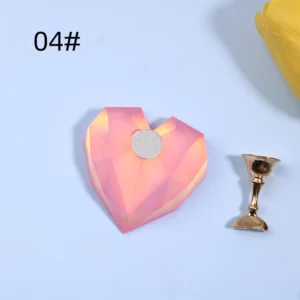 Pinkish coral aurora heart nail base with metallic nail tip stand