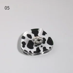 Single cow print nail stand with silver holder on square acrylic base