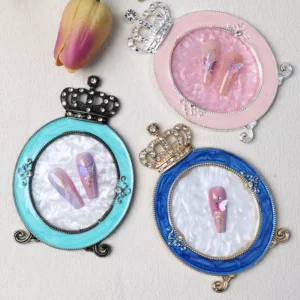 Crown-shaped vintage nail palettes in pink, blue, and aqua enamel