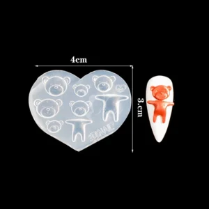 Bear-themed heart nail mold with completed teddy nail art accent