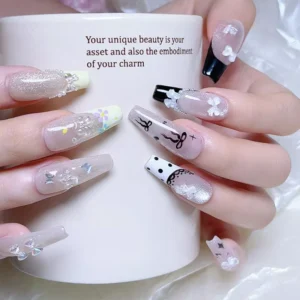 Manicure featuring clear mini bow nail charms with mix of designs