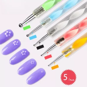 Dotting pens in use creating nail art flowers on purple polish