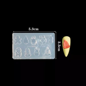 Christmas-themed silicone mold with mini gingerbread, trees, hats, and holiday nail art