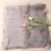 Nail Photography Mat - Plush Fur Texture, Flawless Display 11 Gray faux fur nail photography mat with soft texture and tulips on top