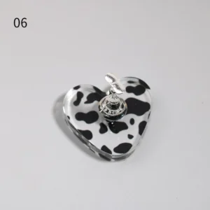 Heart-shaped cow print base with silver magnetic holder for nail tips