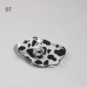Organic cow-patterned acrylic base with silver nail holder