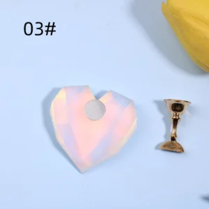 White opal-like crystal heart nail stand with metallic holder