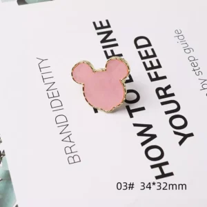 Mickey-inspired pink metal nail palette with gold trim
